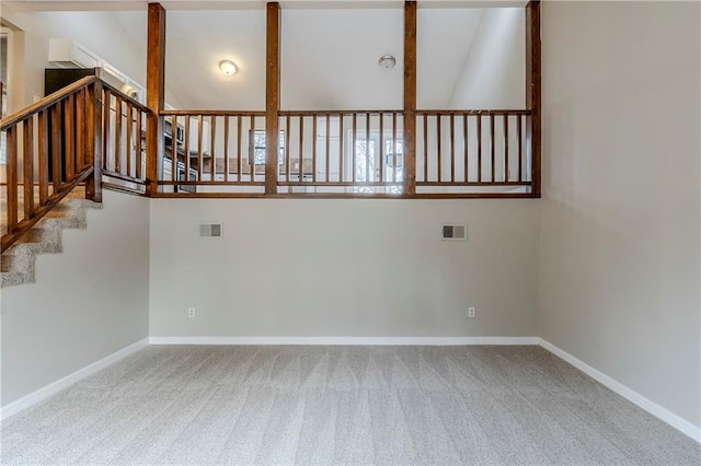 unfurnished room featuring baseboards, visible vents, and carpet flooring