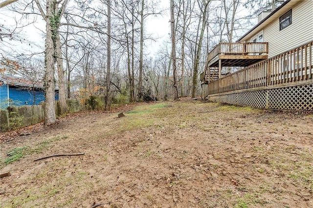 view of yard featuring a wooden deck