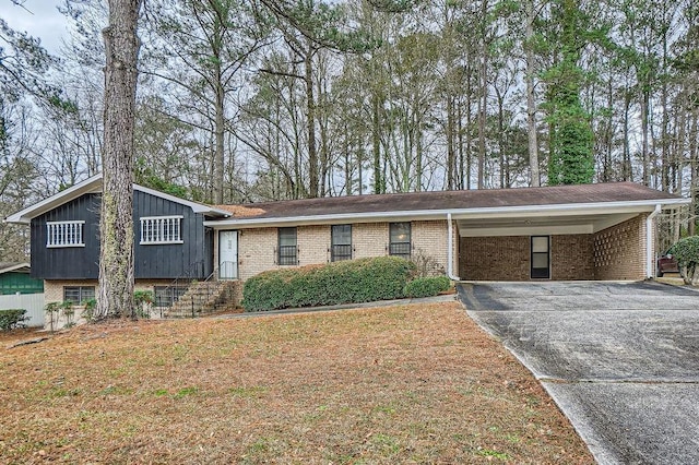 tri-level home featuring a carport