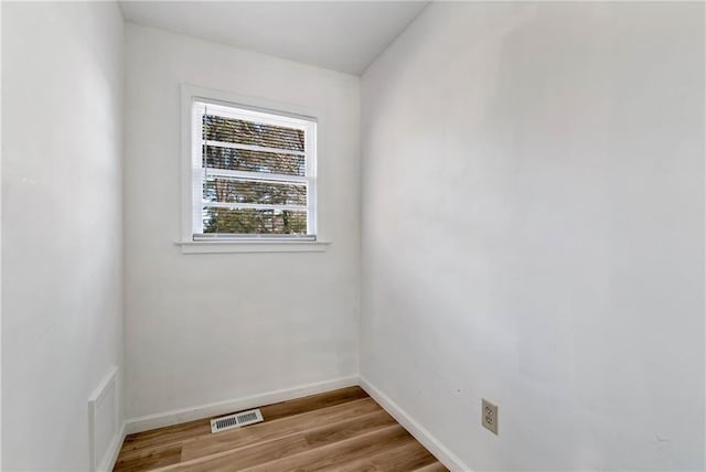 spare room featuring light wood-type flooring