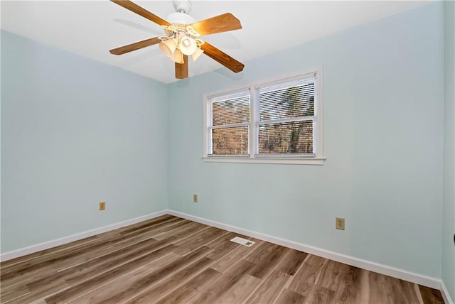 empty room with wood-type flooring and ceiling fan