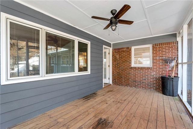 wooden deck with ceiling fan