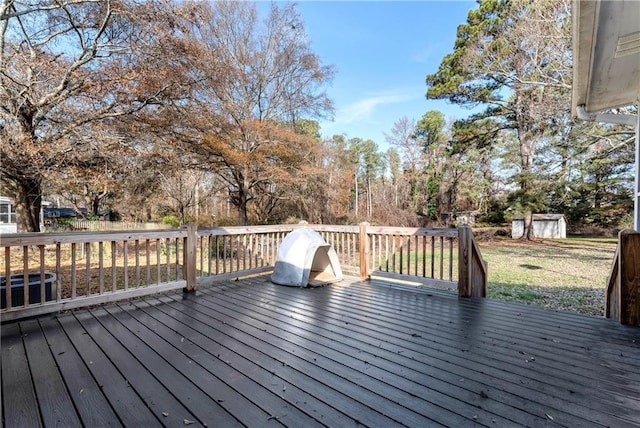 wooden terrace with a shed