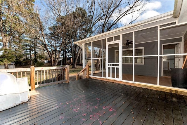 wooden terrace featuring a sunroom