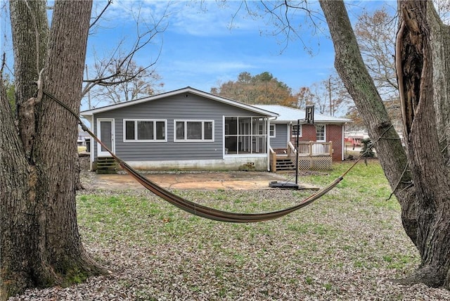 rear view of house with a deck