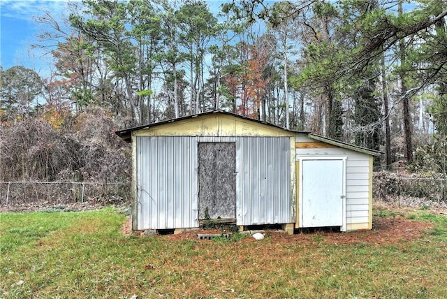 view of outbuilding with a lawn