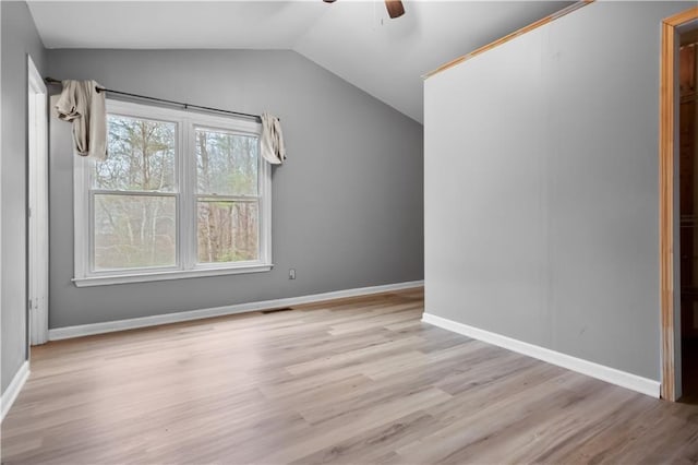 interior space featuring ceiling fan, lofted ceiling, and light wood-type flooring