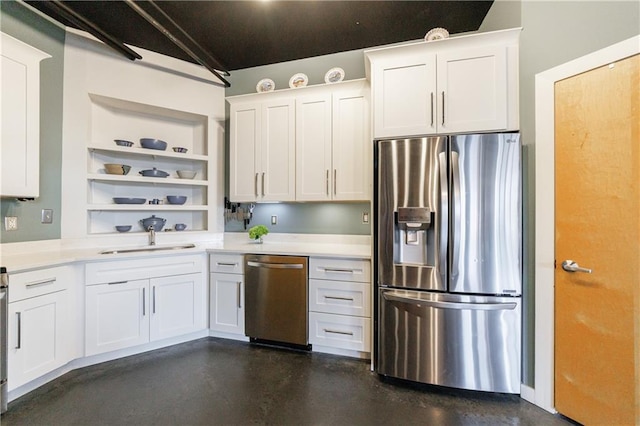 kitchen with open shelves, light countertops, appliances with stainless steel finishes, white cabinetry, and a sink