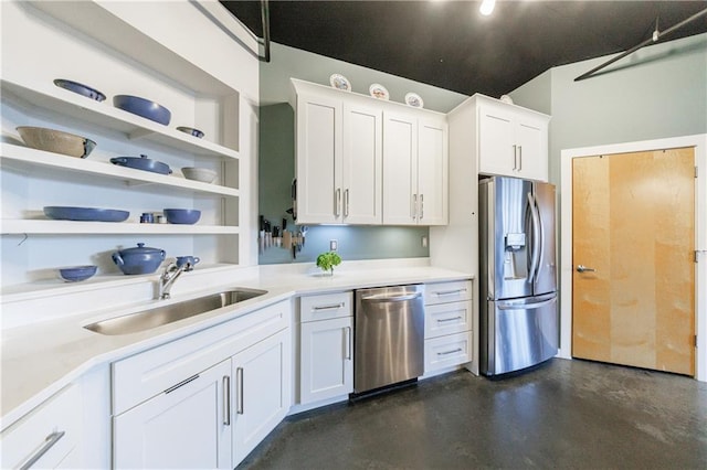 kitchen with stainless steel appliances, white cabinets, a sink, and open shelves