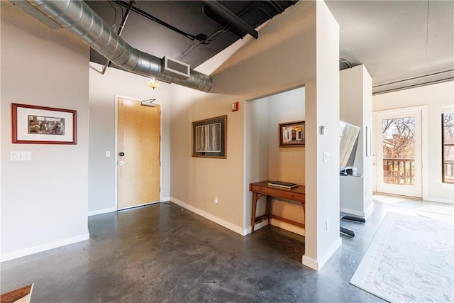 garage featuring visible vents and baseboards