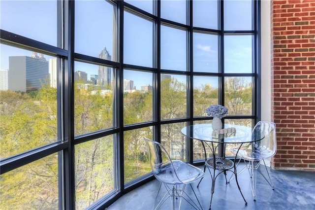 unfurnished sunroom featuring a city view