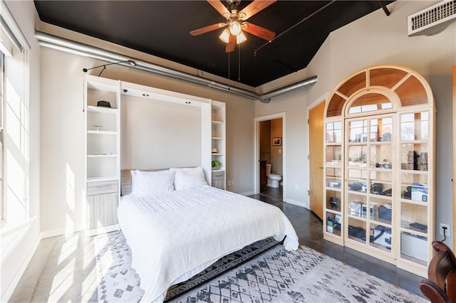 bedroom with visible vents and baseboards