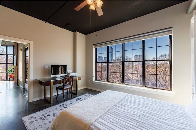 bedroom featuring baseboards and a ceiling fan