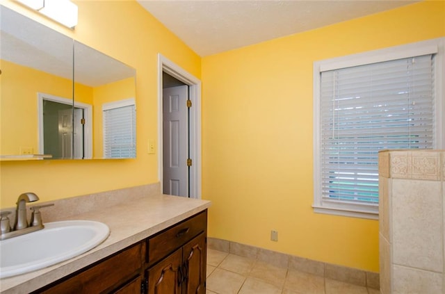 bathroom with tile patterned floors and vanity