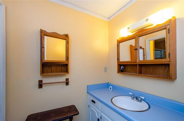 bathroom with vanity and crown molding