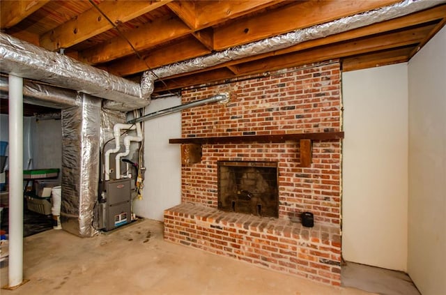 basement with heating unit and a fireplace