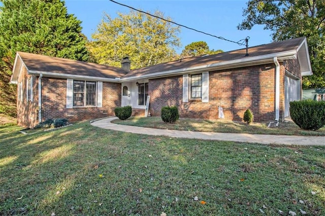 ranch-style home with a front lawn and a garage