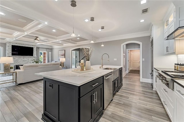 2444 Ballantrae Cir, Cumming, GA 30041 - kitchen featuring arched walkways, appliances with stainless steel finishes, and white cabinetry