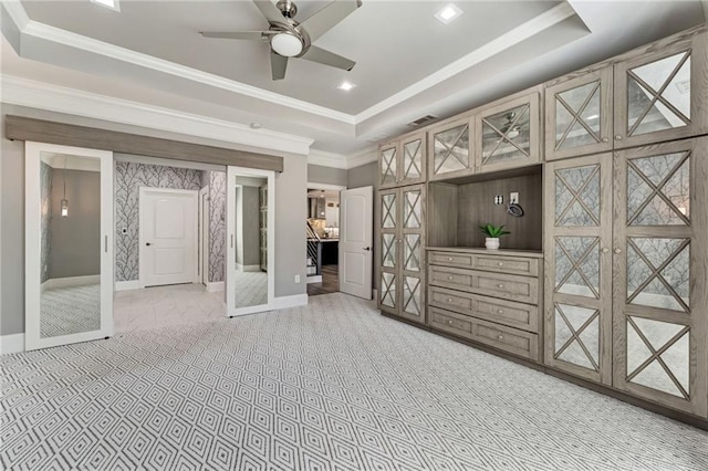 2444 Ballantrae Cir, Cumming, GA 30041 - unfurnished bedroom with baseboards, crown molding, a tray ceiling, and light carpet
