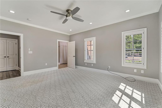 2444 Ballantrae Cir, Cumming, GA 30041 - unfurnished bedroom featuring baseboards, multiple windows, and ornamental molding