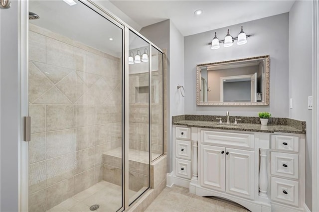 2444 Ballantrae Cir, Cumming, GA 30041 - full bathroom featuring vanity, tile patterned floors, and a stall shower