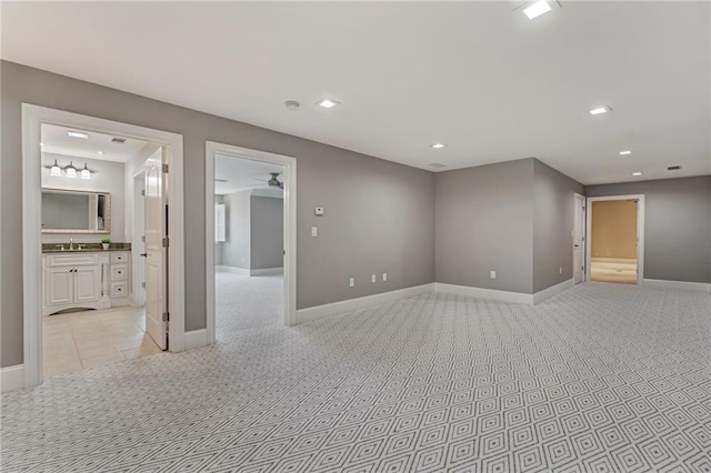 2444 Ballantrae Cir, Cumming, GA 30041 - spare room featuring ceiling fan, light carpet, a sink, recessed lighting, and baseboards