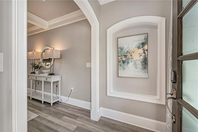 2444 Ballantrae Cir, Cumming, GA 30041 - entryway featuring crown molding, baseboards, arched walkways, and wood finished floors