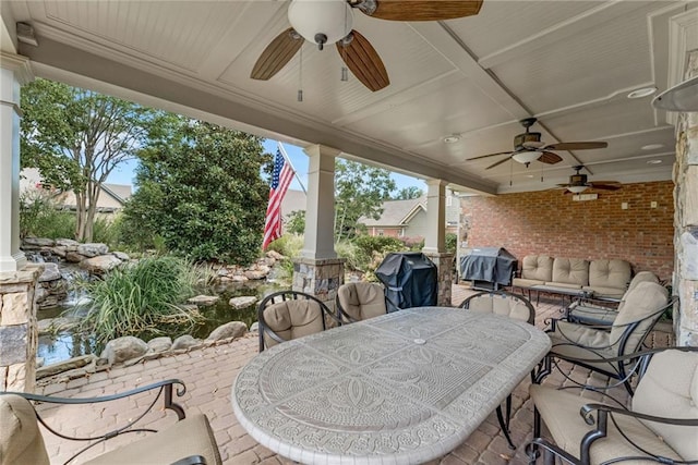 2444 Ballantrae Cir, Cumming, GA 30041 - view of patio with area for grilling, a ceiling fan, and outdoor dining area