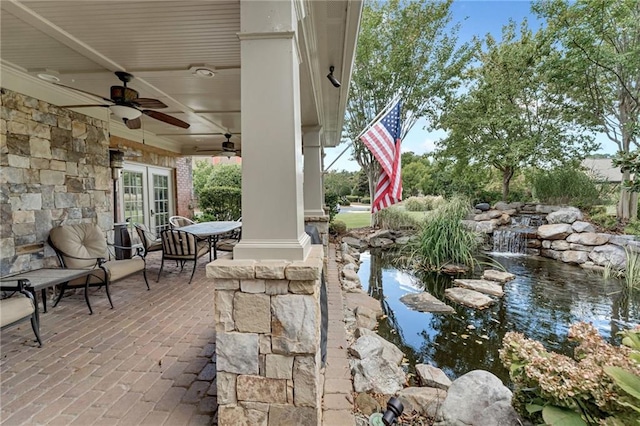 2444 Ballantrae Cir, Cumming, GA 30041 - view of patio featuring a ceiling fan, a garden pond, and french doors