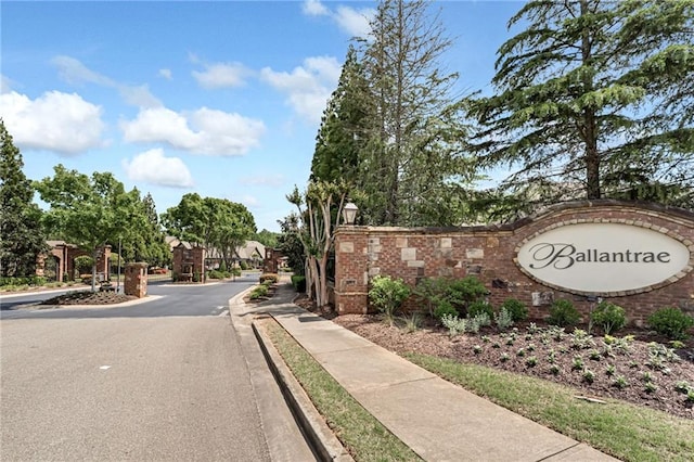 2444 Ballantrae Cir, Cumming, GA 30041 - view of street with street lighting, curbs, a gated entry, and sidewalks