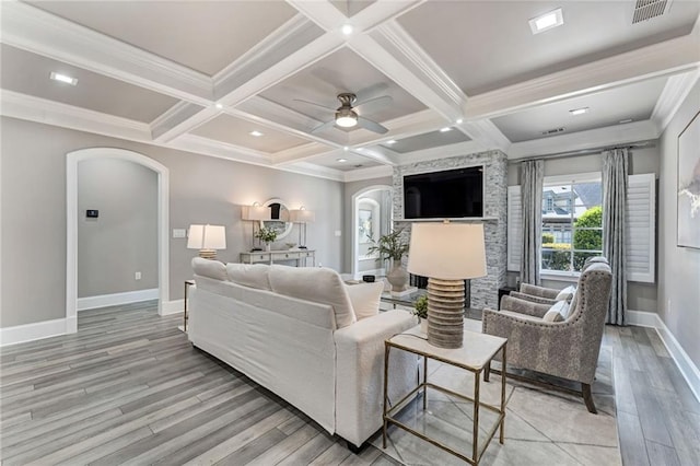 2444 Ballantrae Cir, Cumming, GA 30041 - living room with arched walkways, baseboards, light wood-type flooring, and visible vents