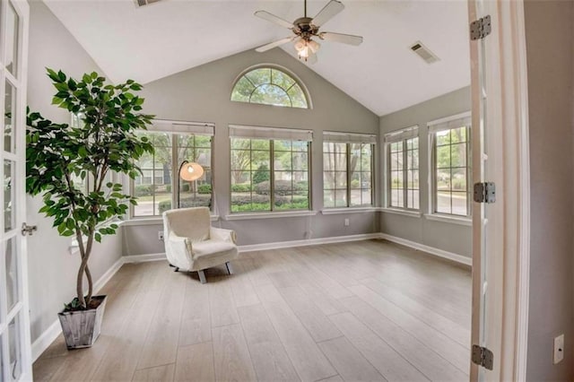 unfurnished room featuring ceiling fan, light hardwood / wood-style floors, and high vaulted ceiling