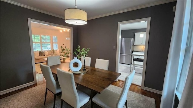 2132 Clairmont Rd, Brookhaven, GA 30033 - dining room featuring baseboards, ornamental molding, and wood finished floors