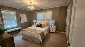 2132 Clairmont Rd, Brookhaven, GA 30033 - carpeted bedroom with baseboards, an inviting chandelier, and crown molding