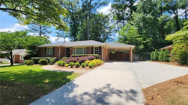 2132 Clairmont Rd, Brookhaven, GA 30033 - single story home featuring fence, a carport, concrete driveway, a front yard, and brick siding
