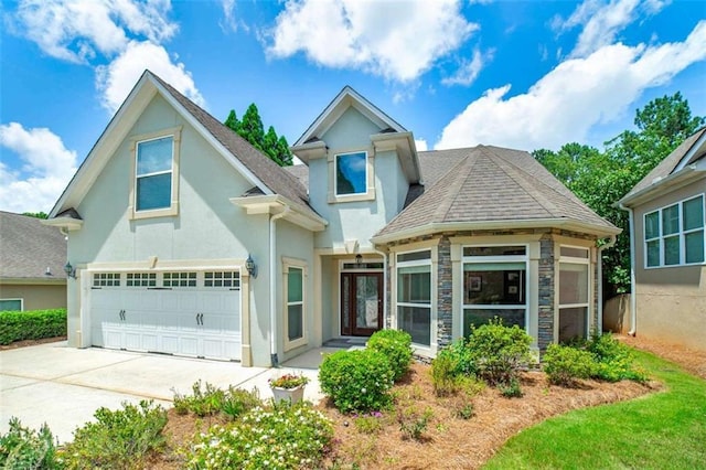 825 Chalet Hls, Mcdonough, GA 30253 - view of front of home featuring stucco siding, concrete driveway, a garage, stone siding, and roof with shingles