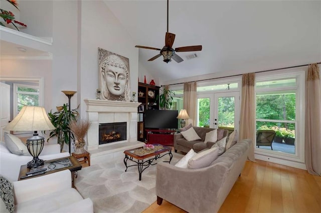 825 Chalet Hls, Mcdonough, GA 30253 - living room featuring ceiling fan, high vaulted ceiling, a glass covered fireplace, french doors, and wood-type flooring