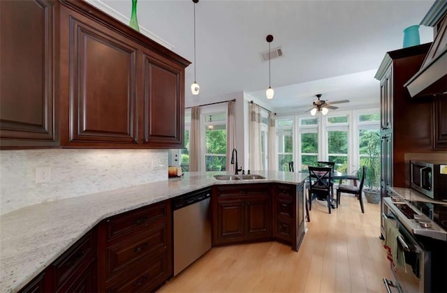 825 Chalet Hls, Mcdonough, GA 30253 - kitchen featuring stainless steel appliances, healthy amount of natural light, backsplash, and light wood-style floors