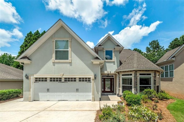 825 Chalet Hls, Mcdonough, GA 30253 - view of front of house featuring driveway, stucco siding, and an attached garage