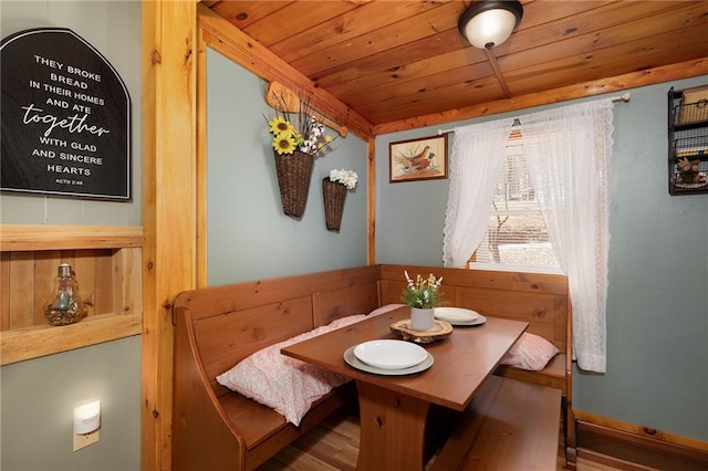 dining area featuring wooden ceiling and breakfast area