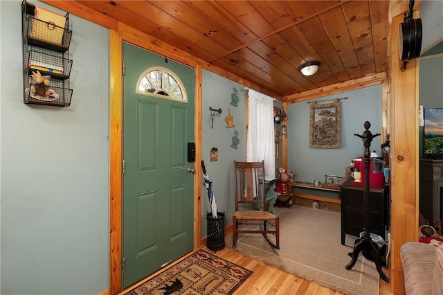 entrance foyer with wood finished floors and wooden ceiling