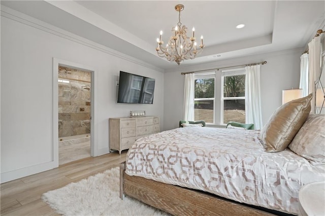 bedroom featuring baseboards, an inviting chandelier, a tray ceiling, crown molding, and light wood-type flooring