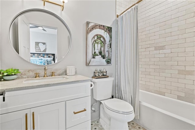 bathroom featuring shower / tub combo, vanity, and toilet