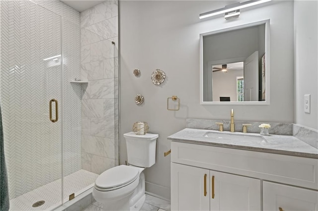 bathroom with toilet, marble finish floor, a shower stall, and vanity