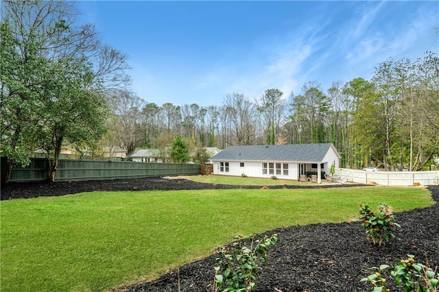 view of yard featuring a fenced backyard