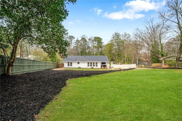 view of yard featuring fence