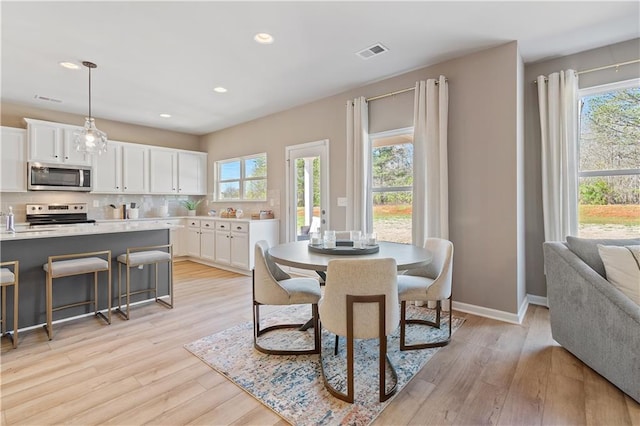 dining room featuring light wood-type flooring