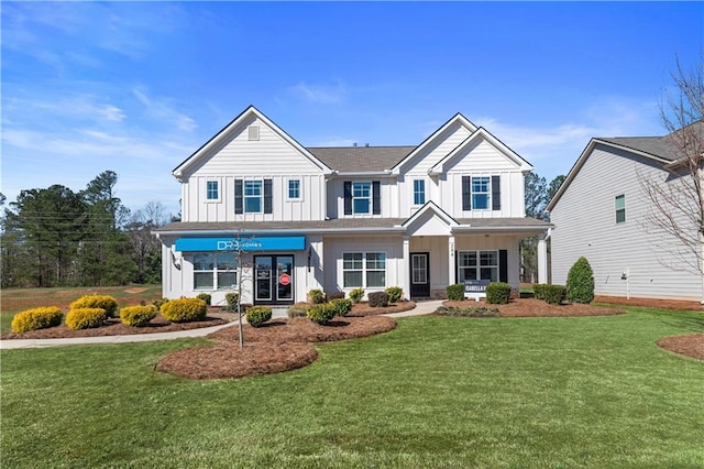 view of front of property with a front yard and a porch