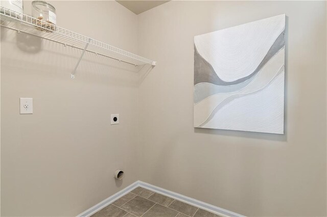 laundry room featuring tile patterned flooring and electric dryer hookup