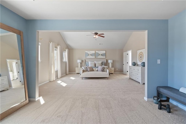 carpeted bedroom featuring lofted ceiling and ceiling fan